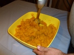 Use a stick blender to mash cooked pumpkin into puree.